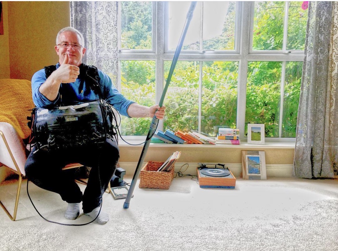 Sound recordist with boom pole and mixer bag on the Airbnb shoot in Windsor